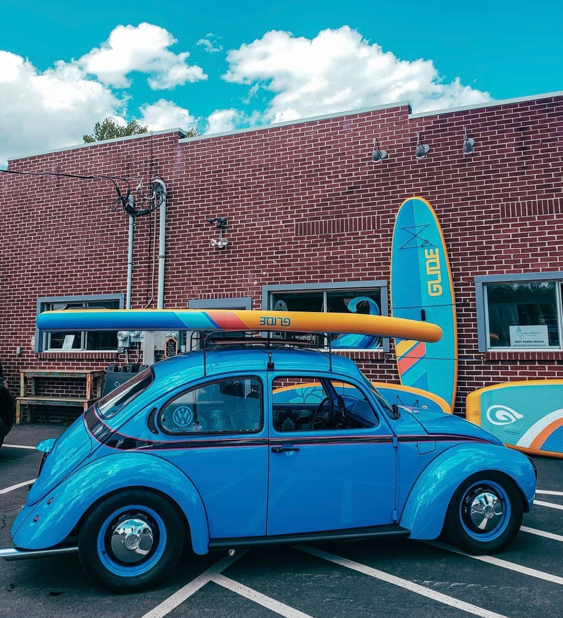 inflatable paddle board on a volkswagen bug