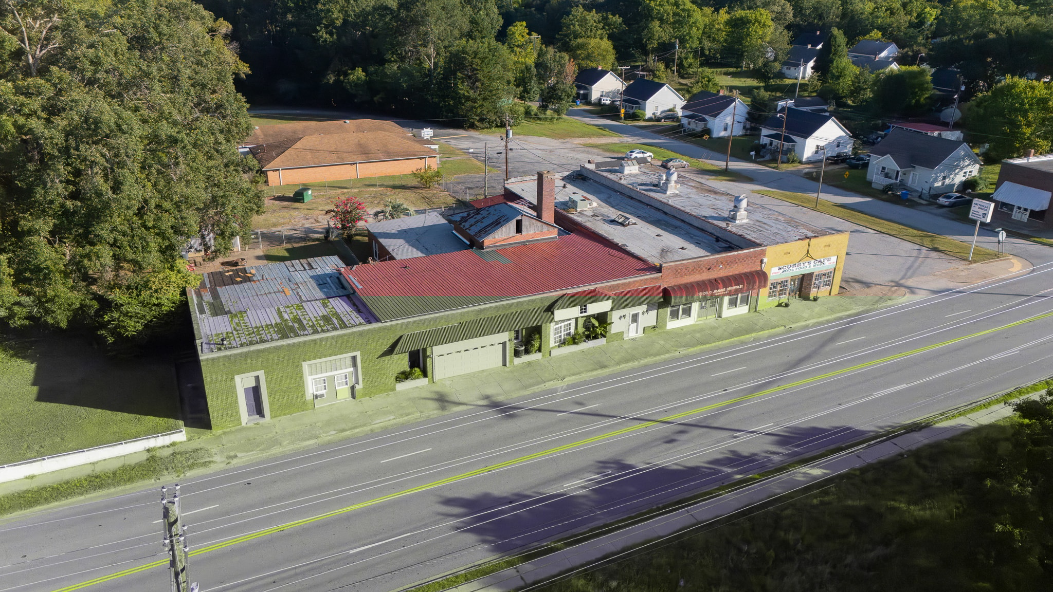It is crucial for construction workers to gather at a multifamily construction site, intently review a quality control checklist and ensure compliance with safety standards and construction processes. A collaborative effort is vial for managing multifamily projects, highlighting the importance of thorough project management for successful construction outcomes.