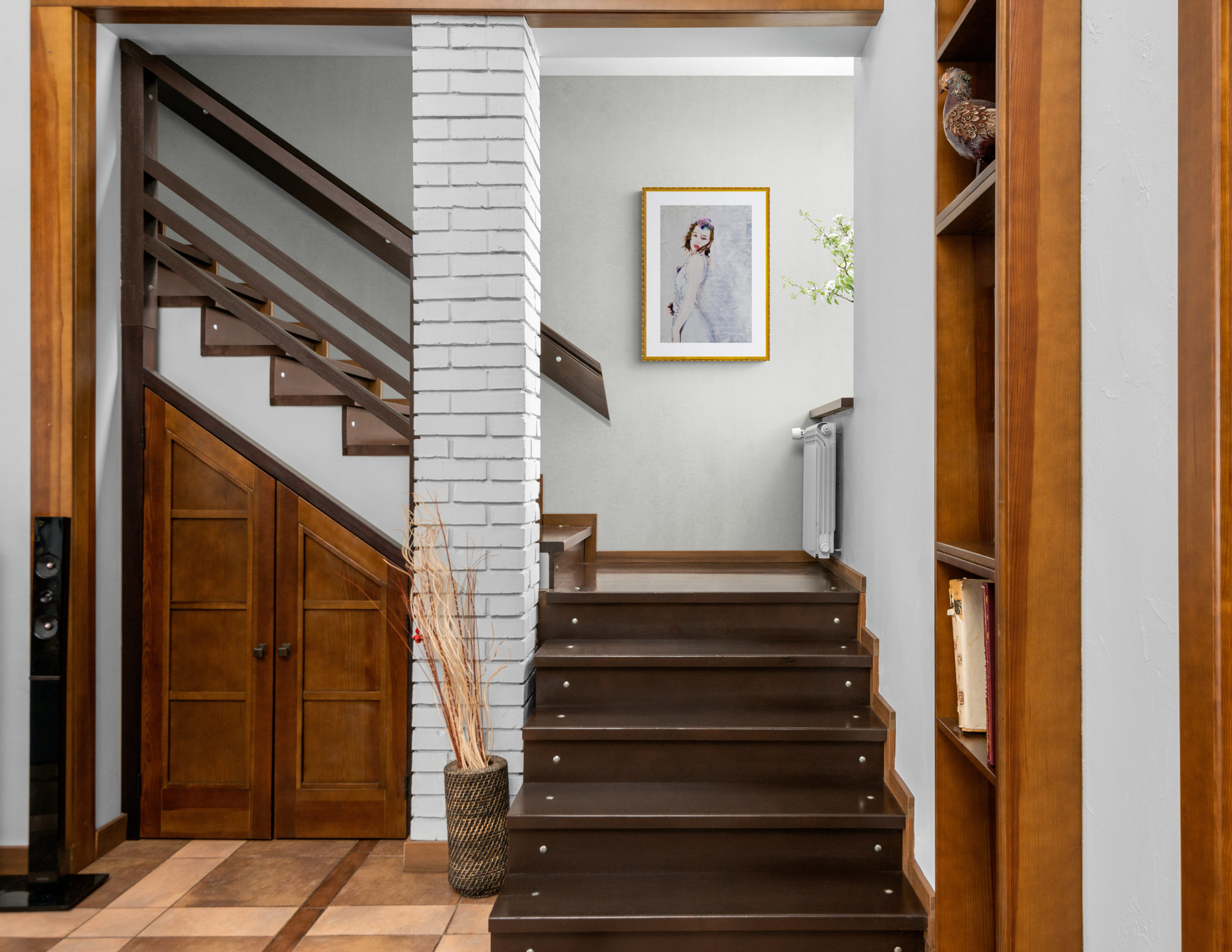 Rustic entry stairway with white walls hanging "And Words Can" by Helen Anne Lemke