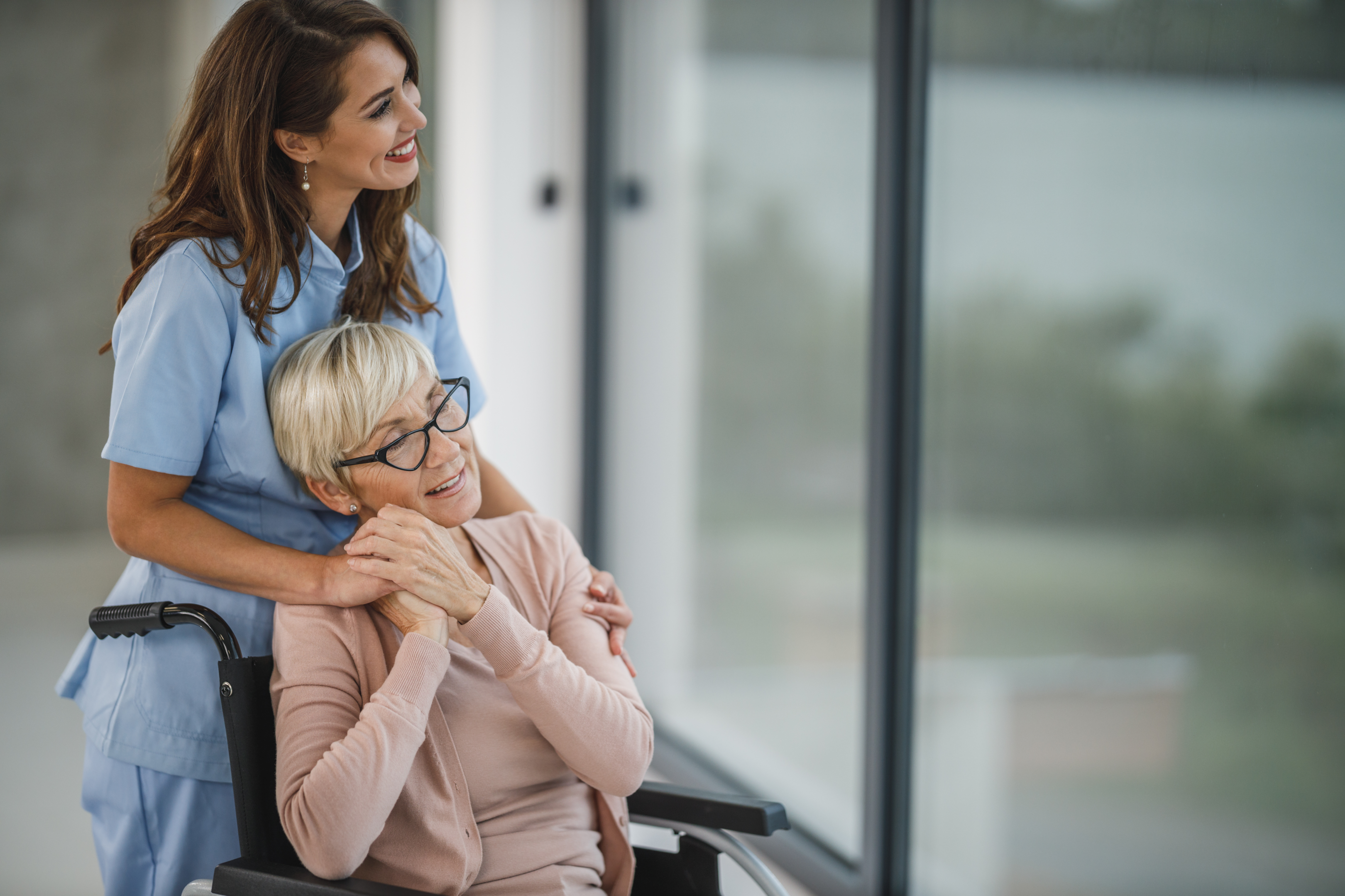 "A young caregiver assists a senior beneficiary of the SSA's expanded Compassionate Allowances Program, a testament to the extended reach of support for individuals with severe disabilities."