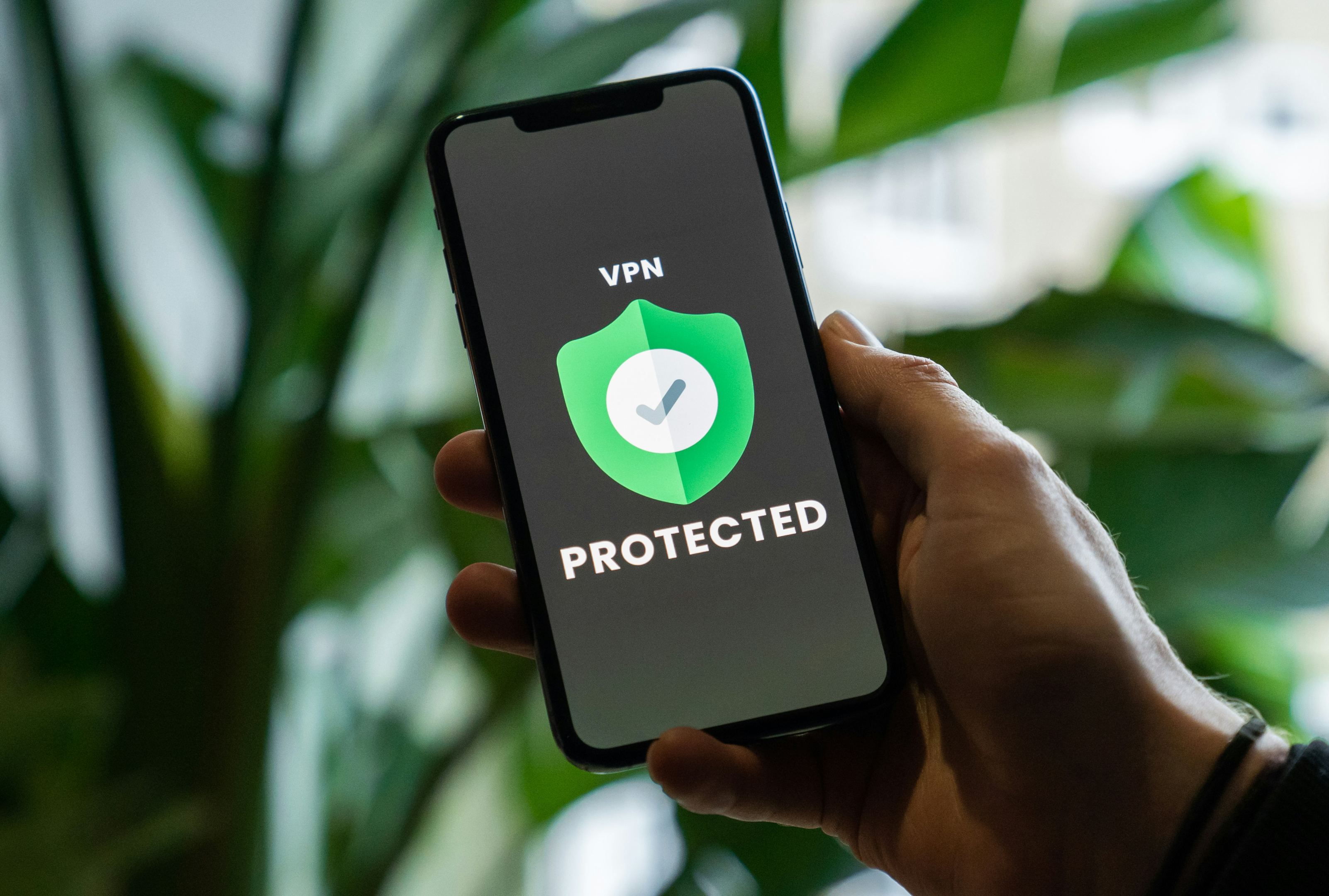 Phone that shows VPN and protected messages with a green shield