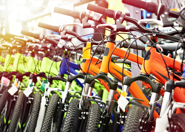 A mountain bike with components being manufactured in a factory