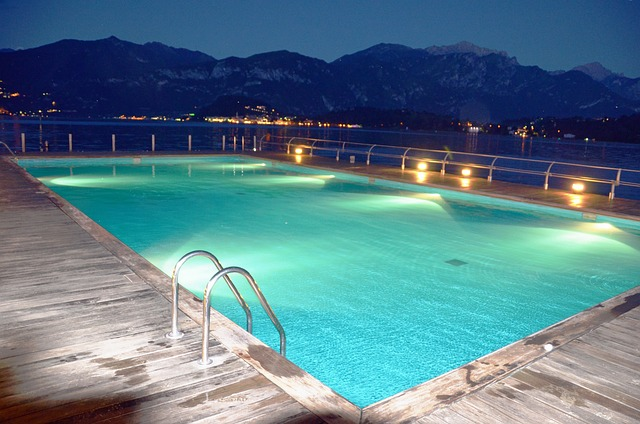Outdoor swimming pool with LED lights for enhanced mood.