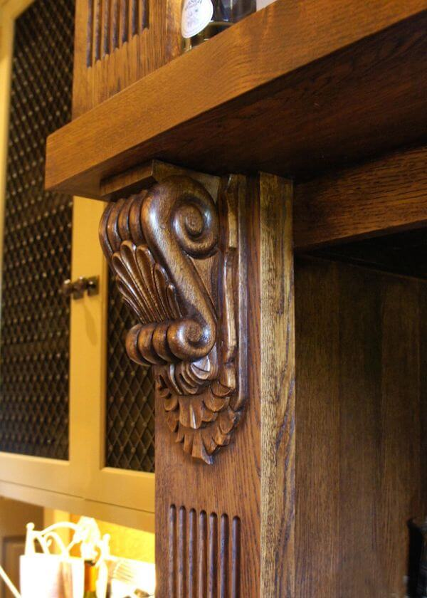 A woooden corbel being used to support shelving
