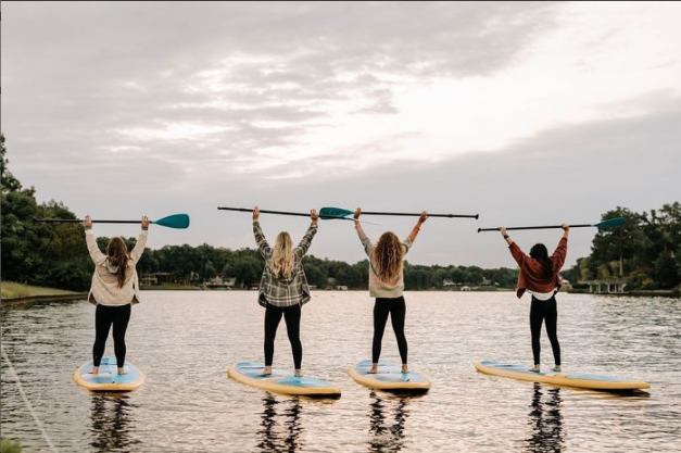 women on paddle boards