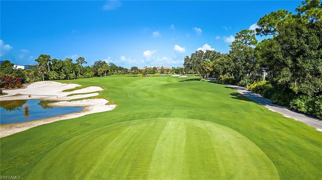This image depicts a luxurious home in the Crown Colony community of Fort Myers, featuring stunning golf course views, a private pool, and beautifully manicured landscaping, perfect for prospective property consumers seeking upscale living in Florida. The serene environment and elegant design highlight the charm of Crown Colony real estate.