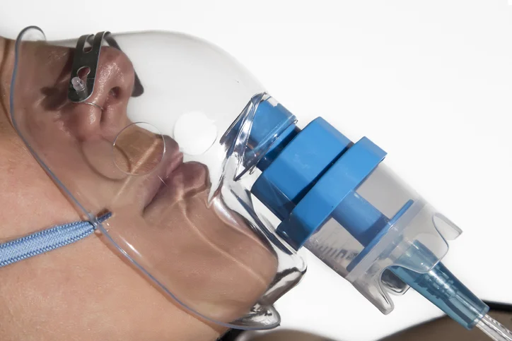 A person with using a breathing machine