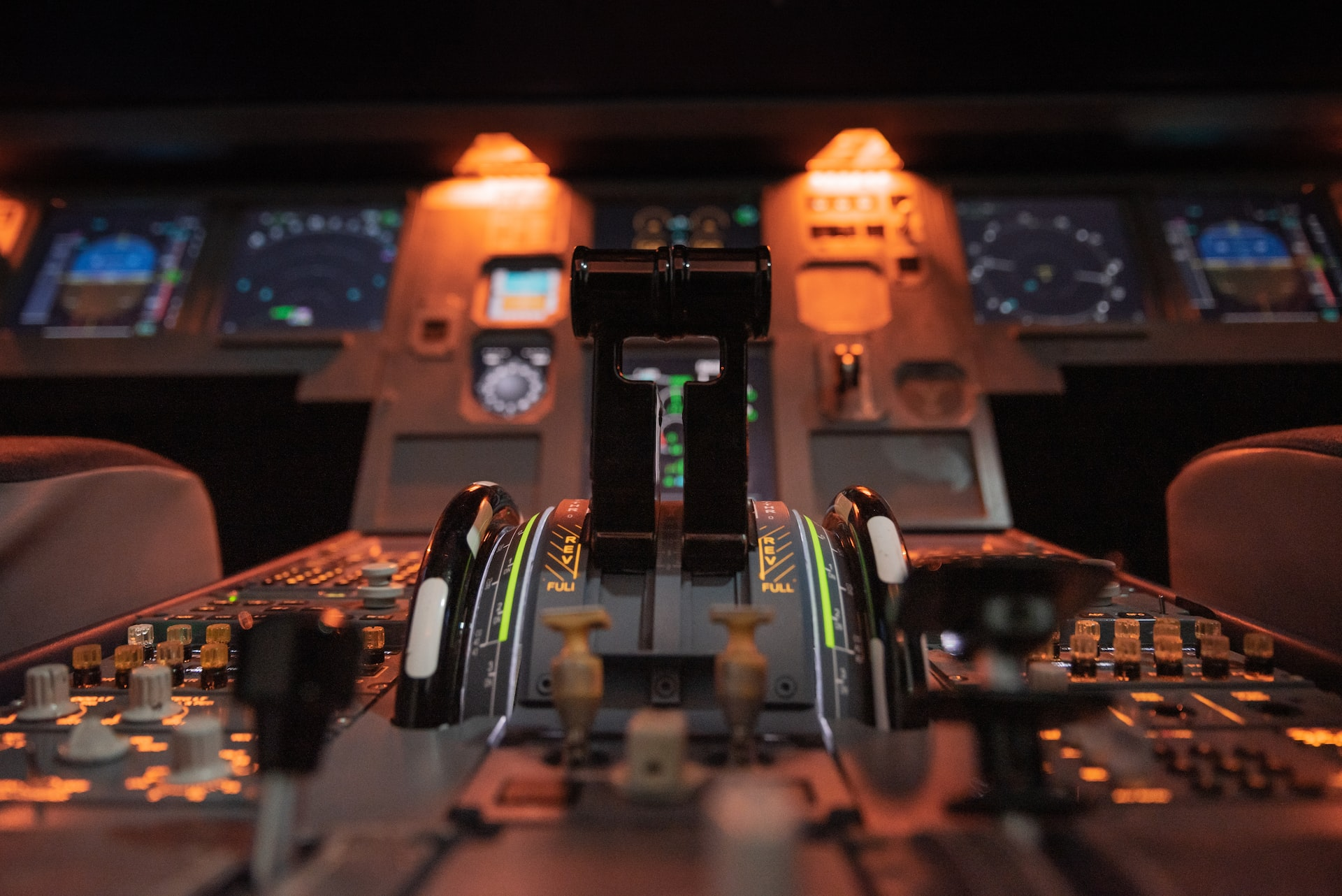 An illuminated aircraft cockpit.