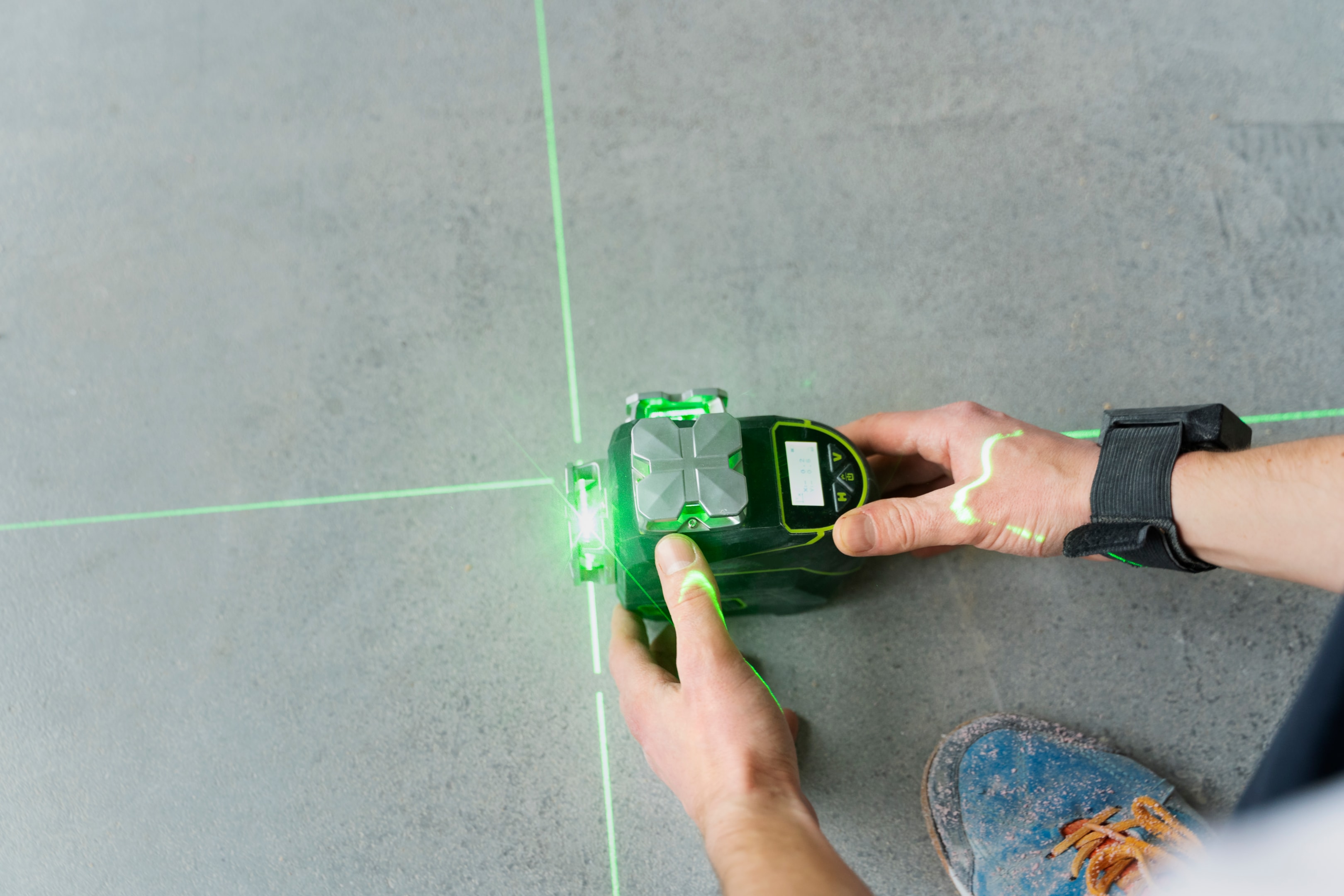 green laser coming out of a laser measure