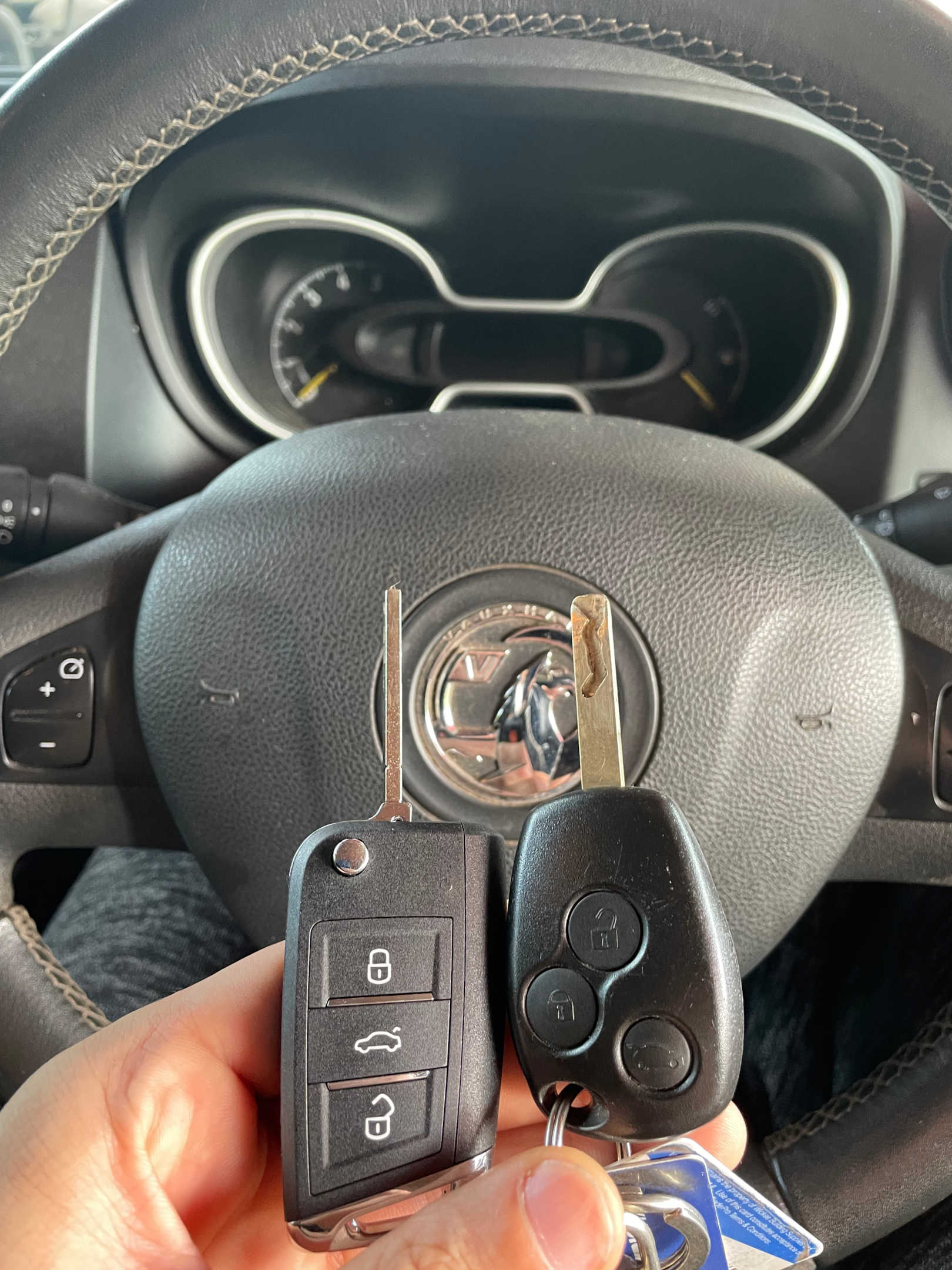 An image of a professional locksmith providing car key replacement near me service for a customer's vehicle.