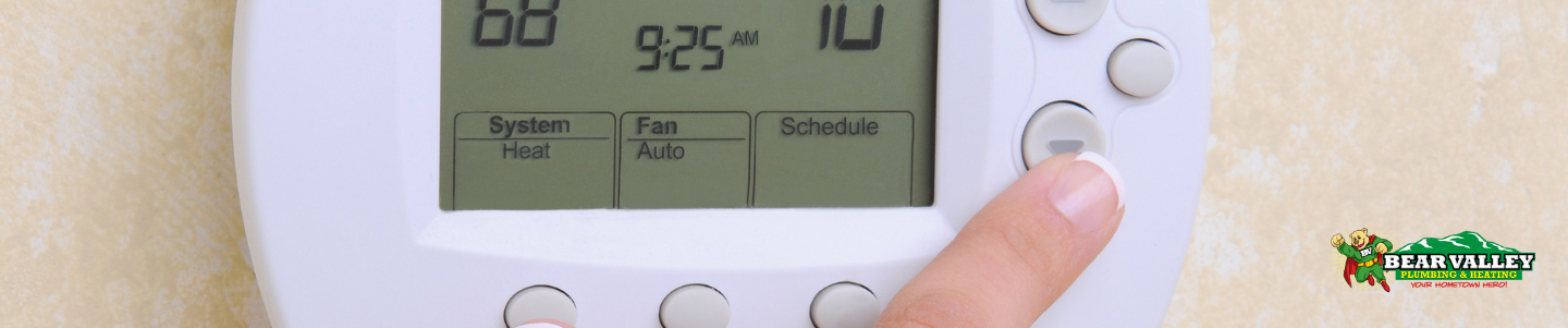 Professional HVAC technician inspecting a faulty thermostat to diagnose and fix issues, ensuring optimal home comfort and energy efficiency.