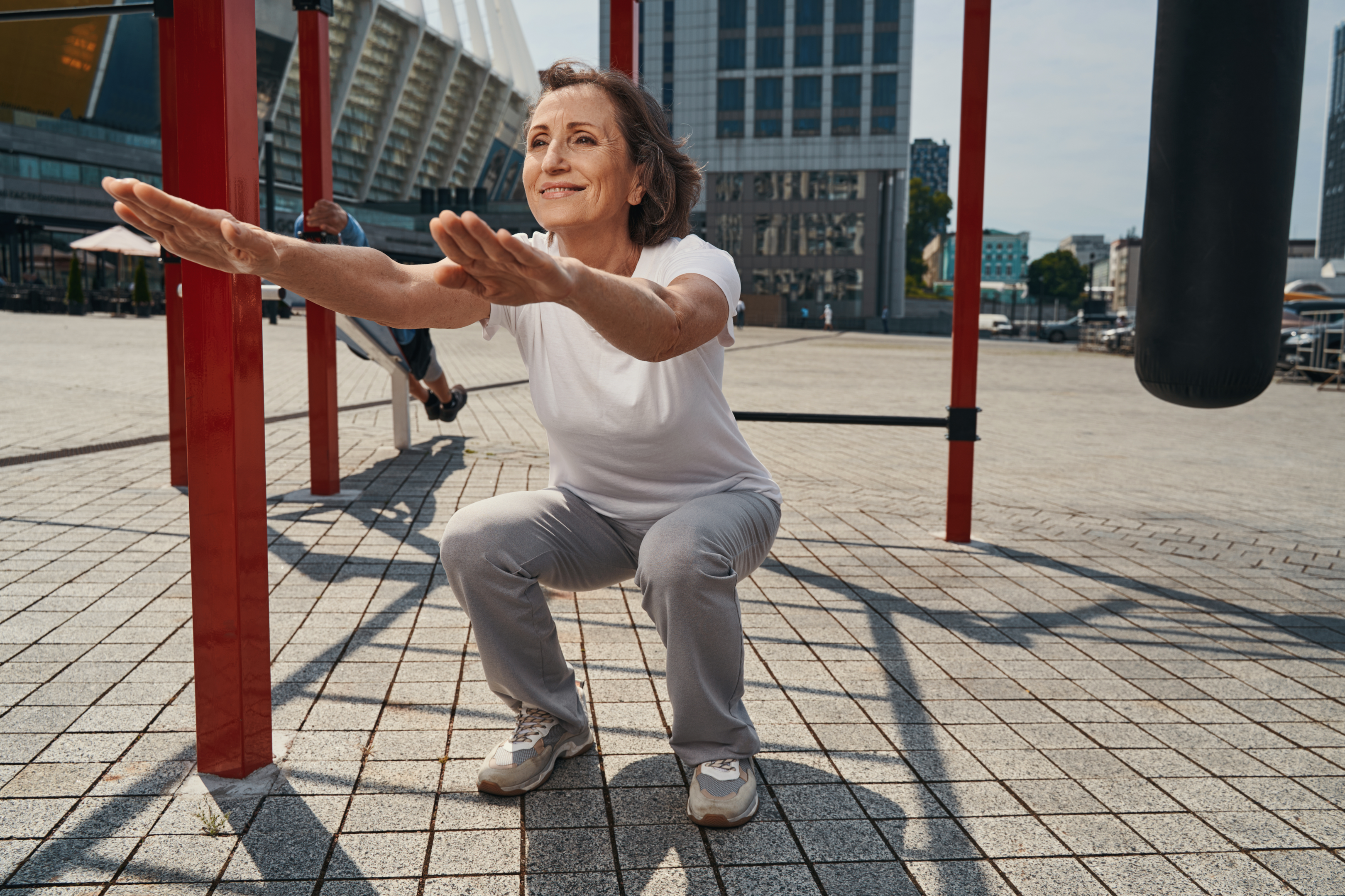 Image of a person doing deep squats with a barbell