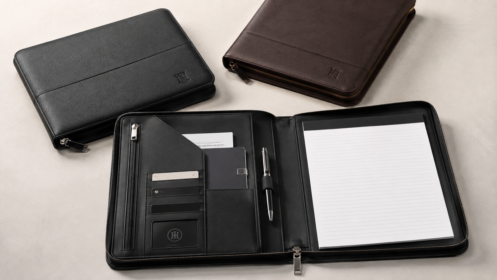 Black executive meeting folio with document pockets, card slots, a pen holder, and lined writing pad