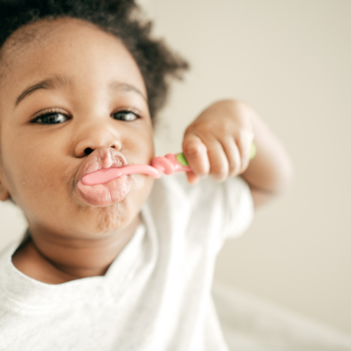 A child brushing their teeth.