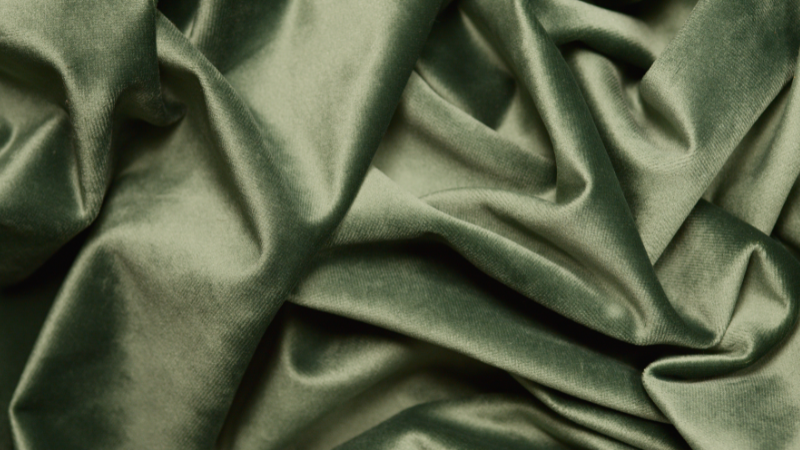 A close-up of a green rayon fabric