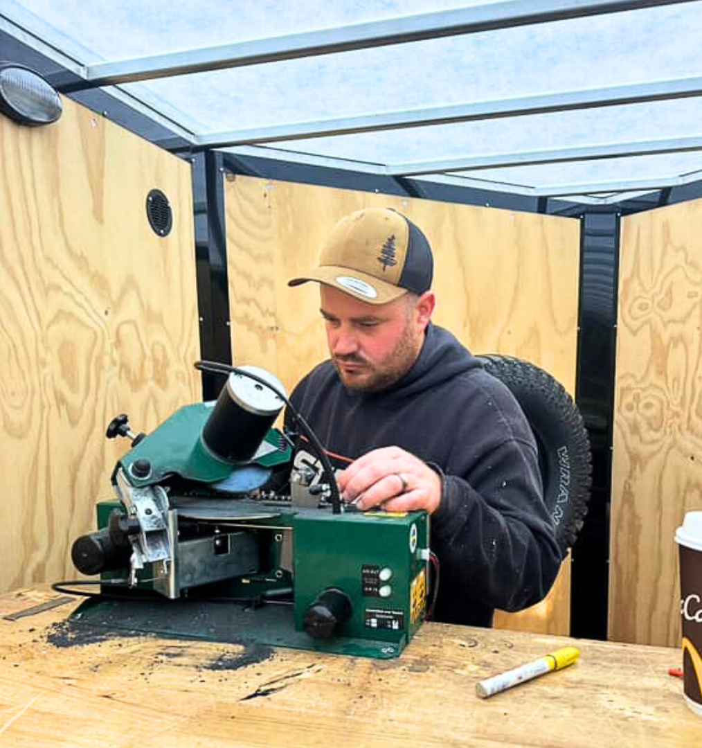 Andrew from ATGO adjusting his Woodland Mills RCS28 PRO Chainsaw Chain Sharpener. 
