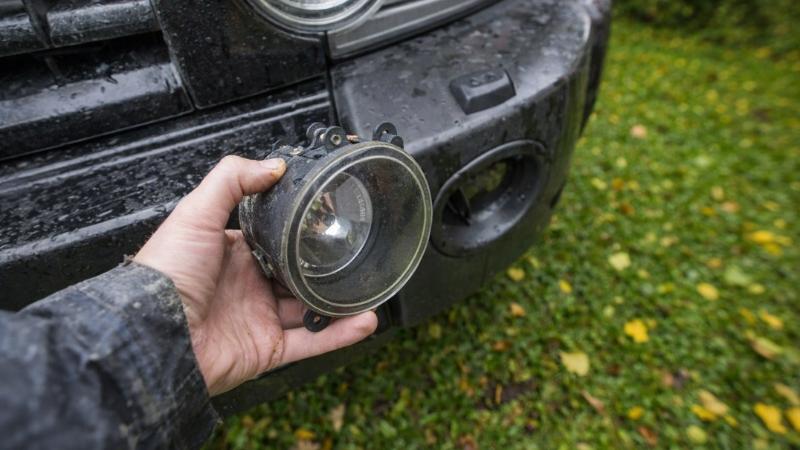 Front fog light of a car being replaced