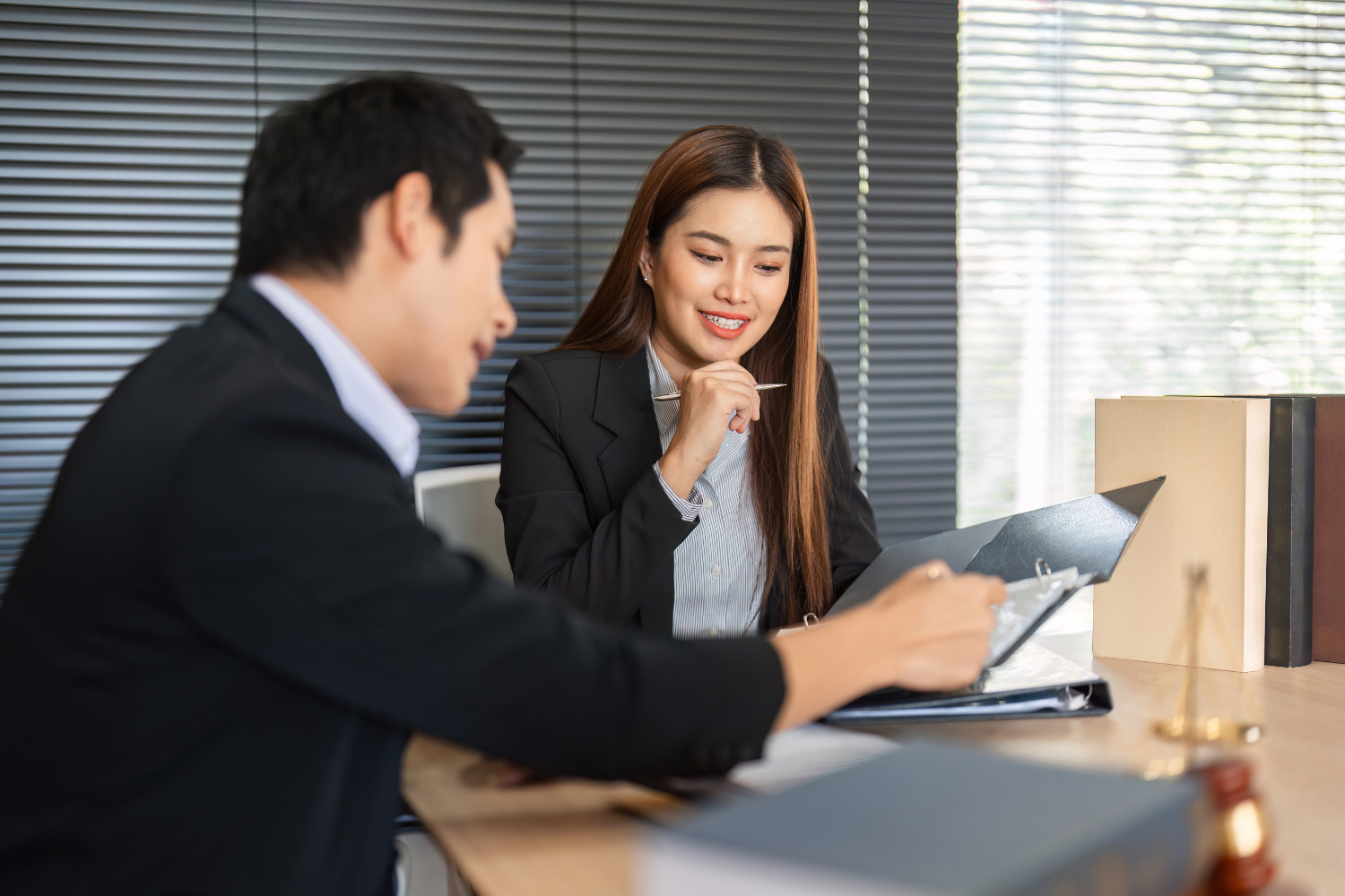 Banker reviewing documents with a client.