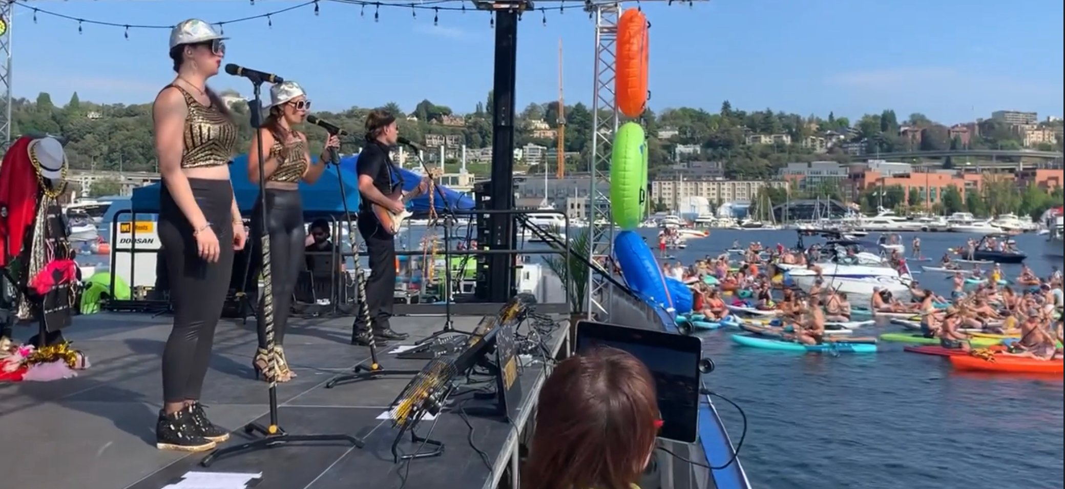 music festival on the water with paddle boards in background
