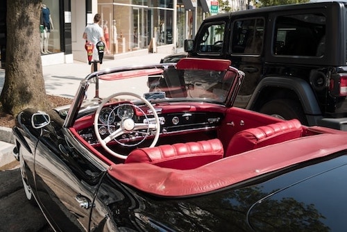 Luxury cars along the Ave