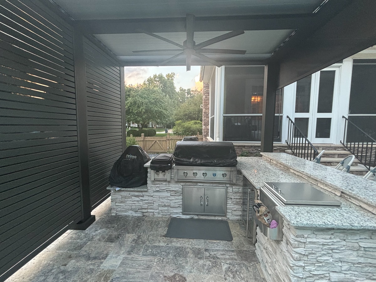 Adding an outdoor kitchen under your pergola is a popular custom pergola design.