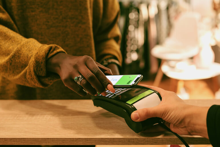 A person holding a wise debit card