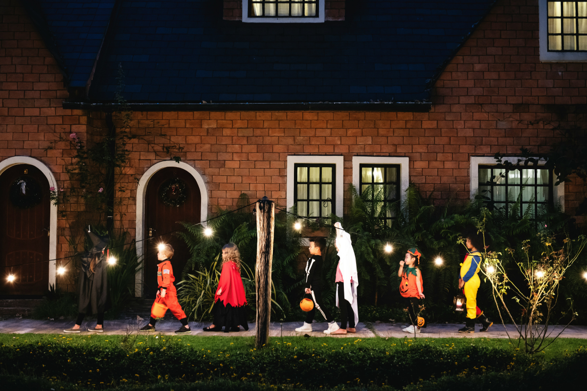 Eco-friendly Halloween porch decor featuring natural elements and pumpkins.