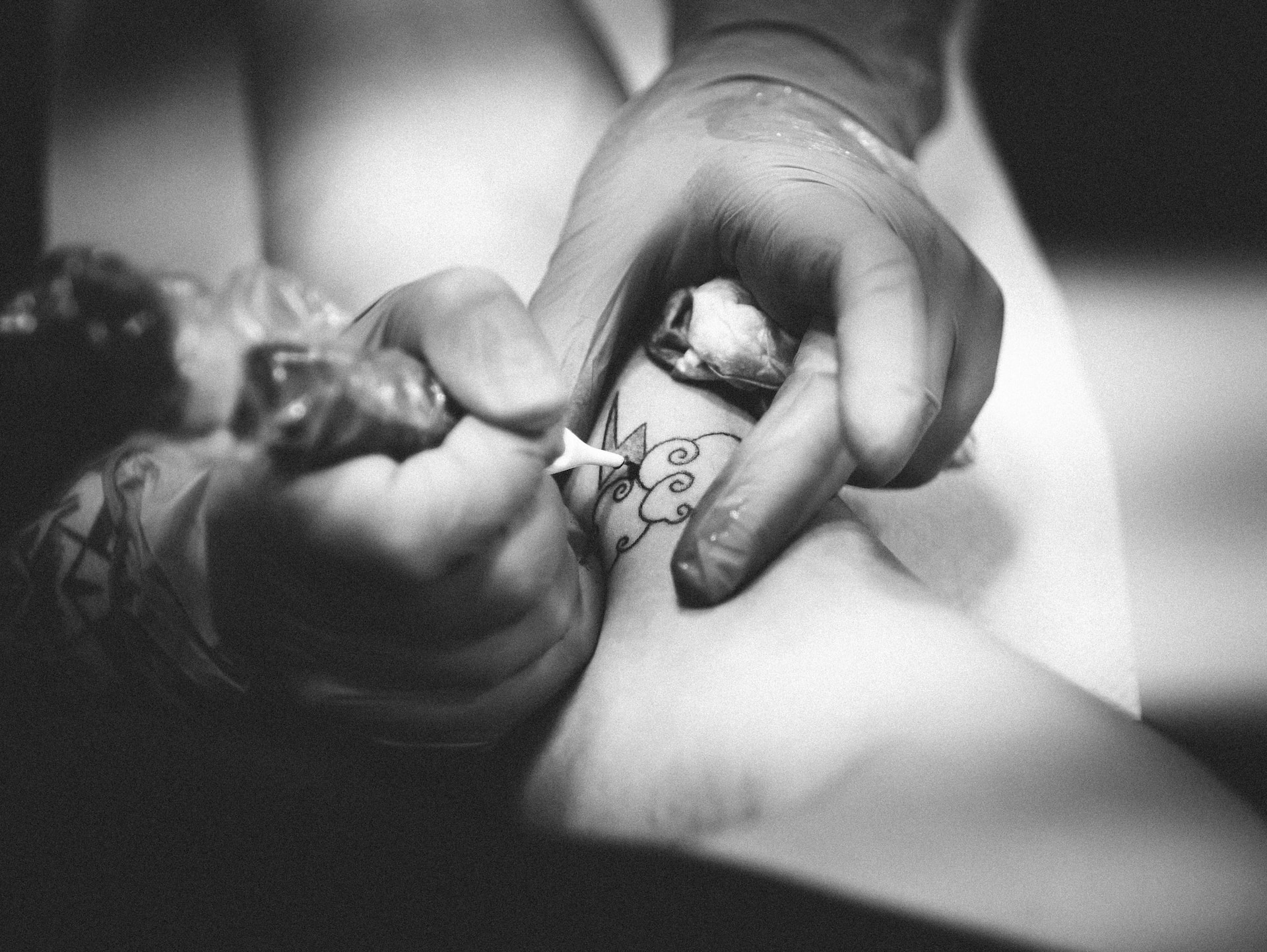 A Tattoo Artist working on a Upper Arm Tattoo