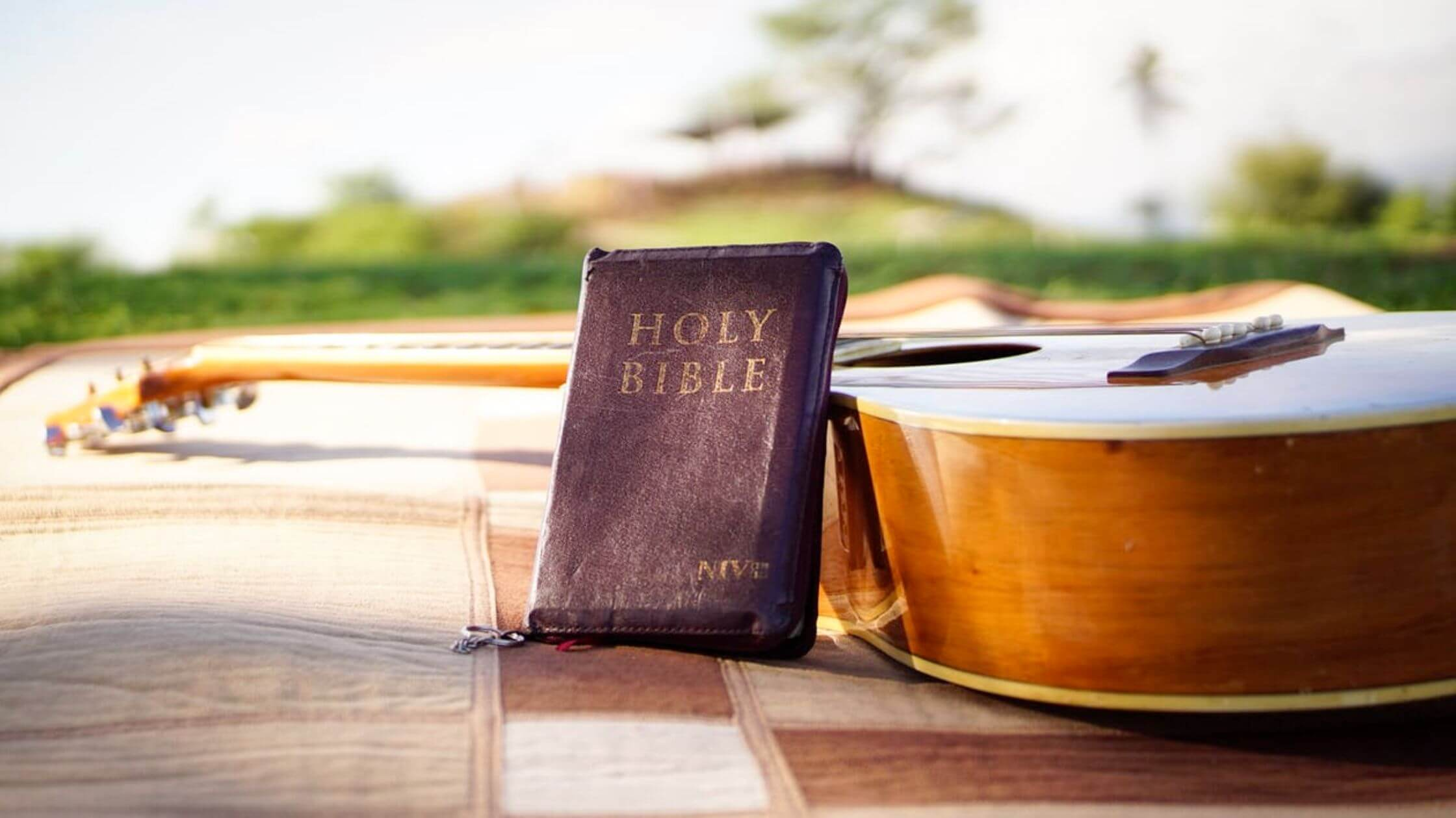 There are refrences to an acoustic guitars type intrument in the bible or similar musical instruments