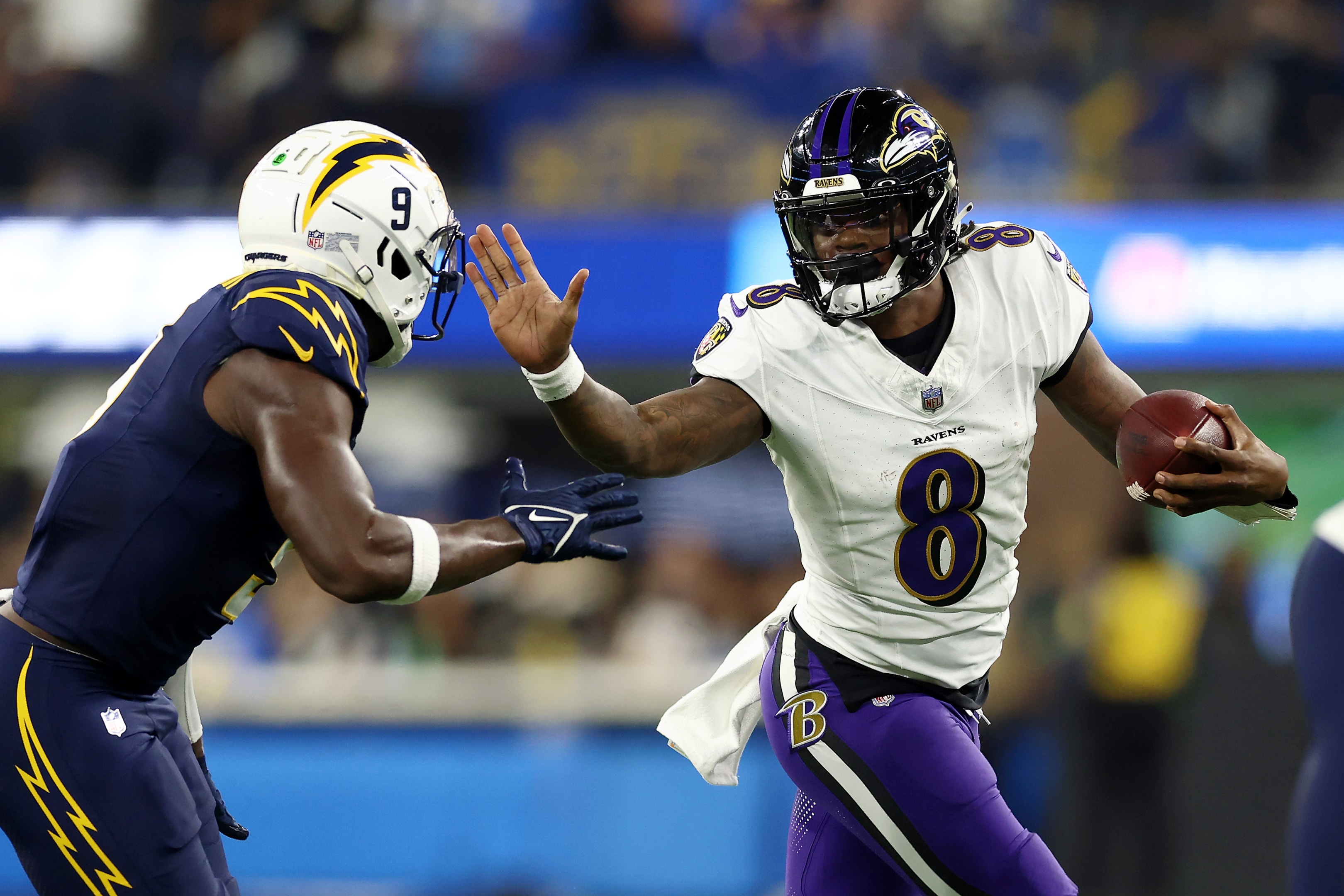 Lamar Jackson of the Baltimore Ravens scrambles out of the pocket against Kenneth Murray Jr. of the Los Angeles Chargers during a game at SoFi Stadium. Never miss a game with our printable nfl schedule.