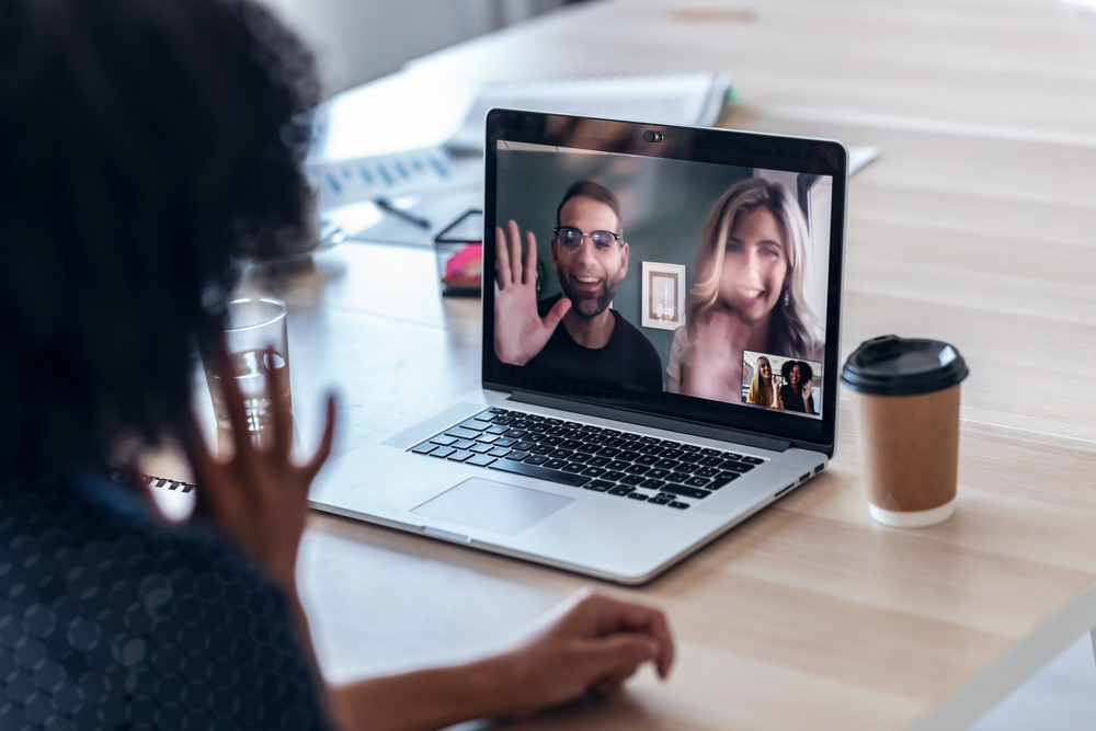 An image of a group of remote employees participating in virtual team building activities during a Remote Team Mentorship Program".