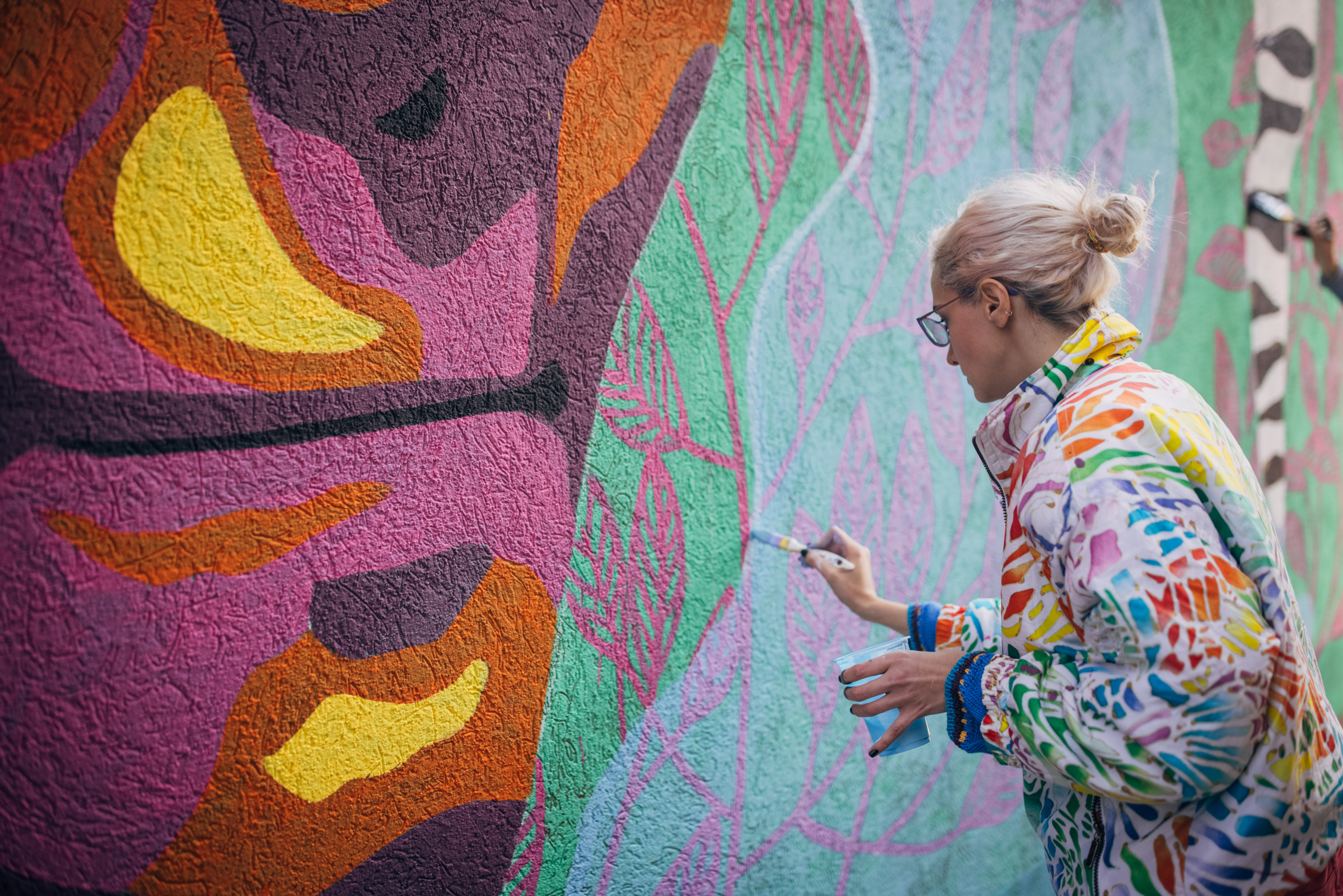 Artist painting on a wall 