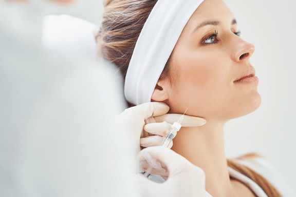 woman receiving botox injections for her TMJ disorder