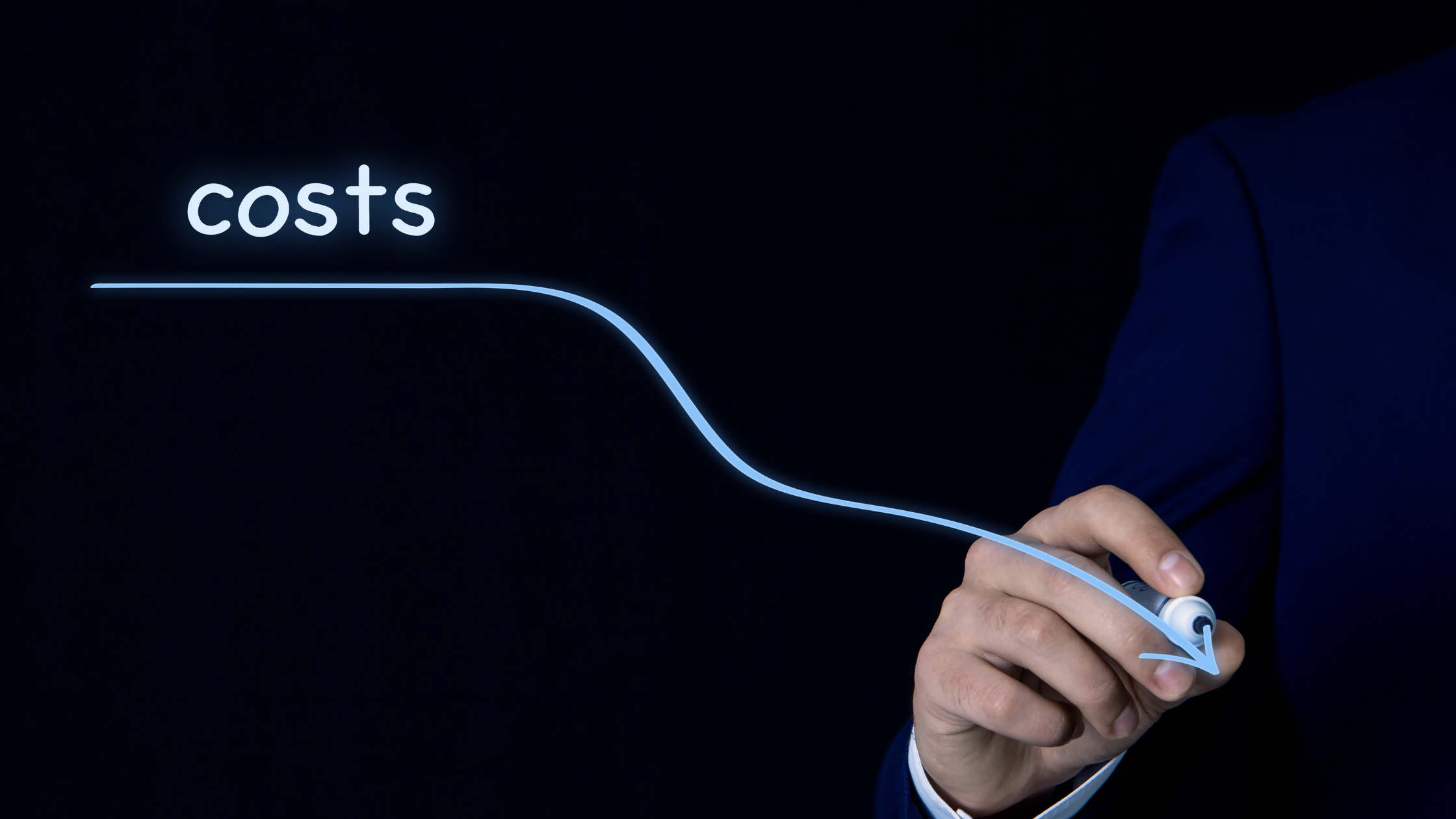 A hand drawing a downward curve labeled 'costs,' illustrating cost reduction and financial efficiency strategies.