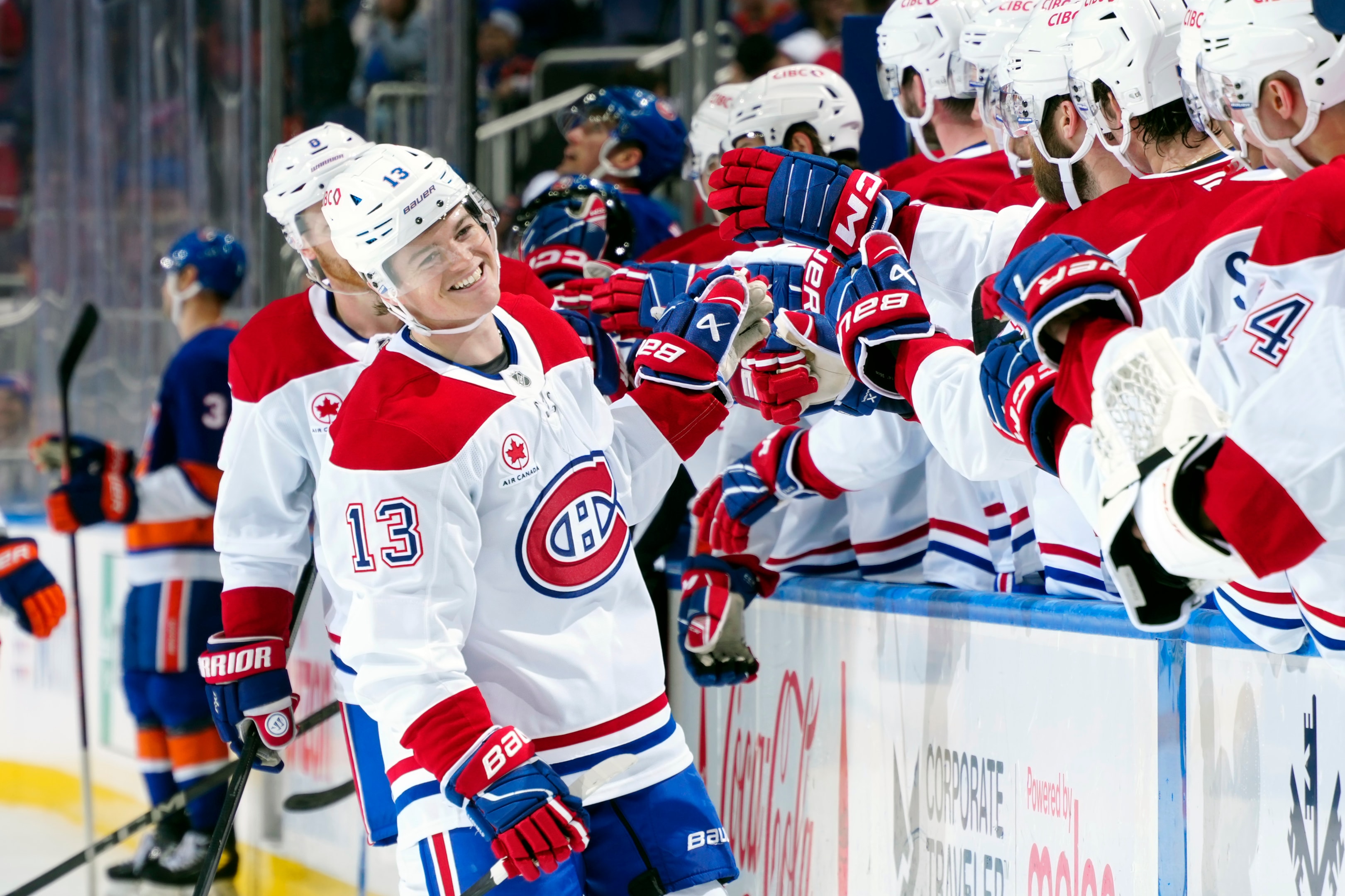 Cole Caufield of the Montreal Canadiens is congratulated by his teammates after scoring a goal during an NHL game at UBS Arena on October 19, 2024 in Elmont, New York. 