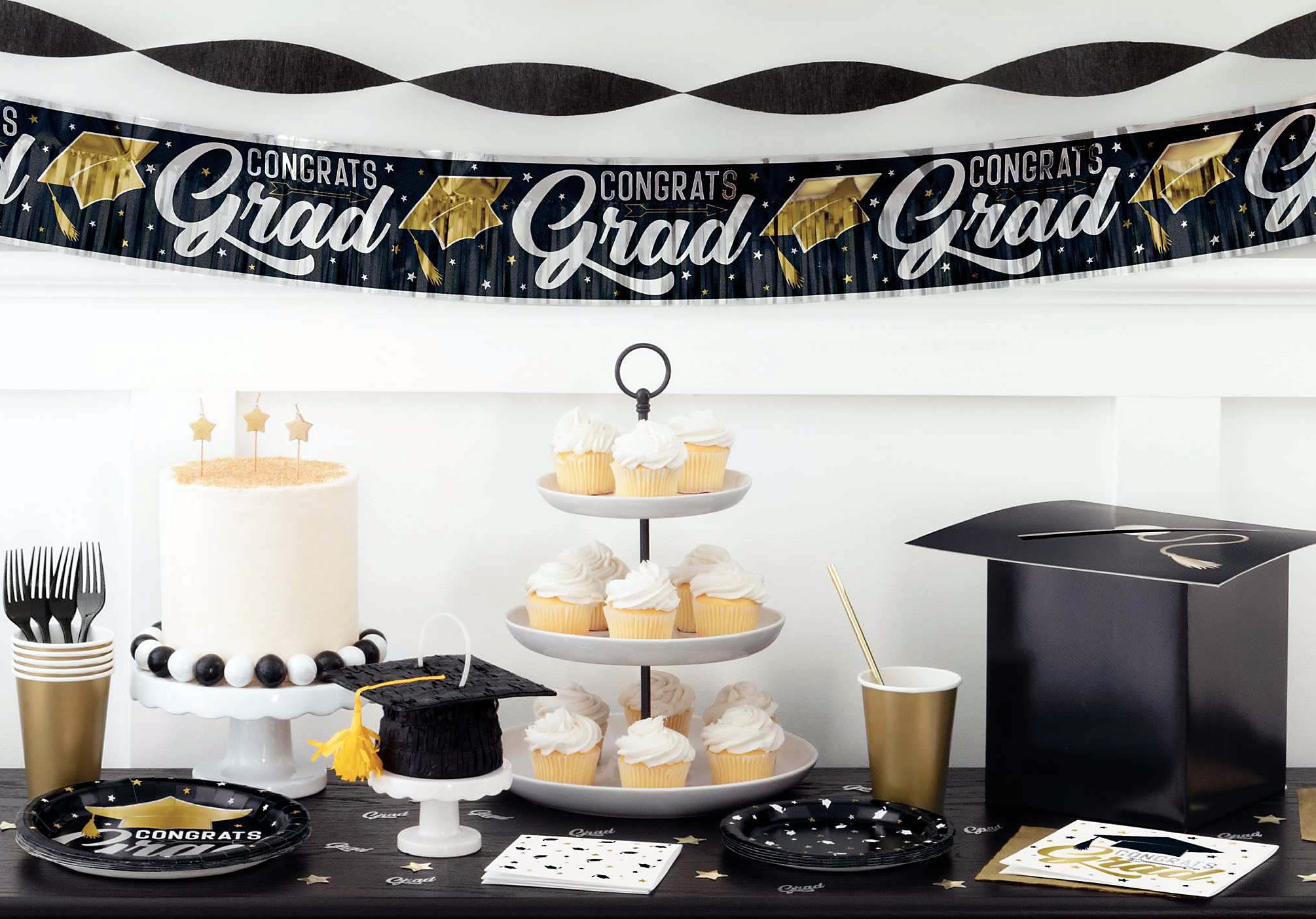 Graduation dessert table with cupcakes.