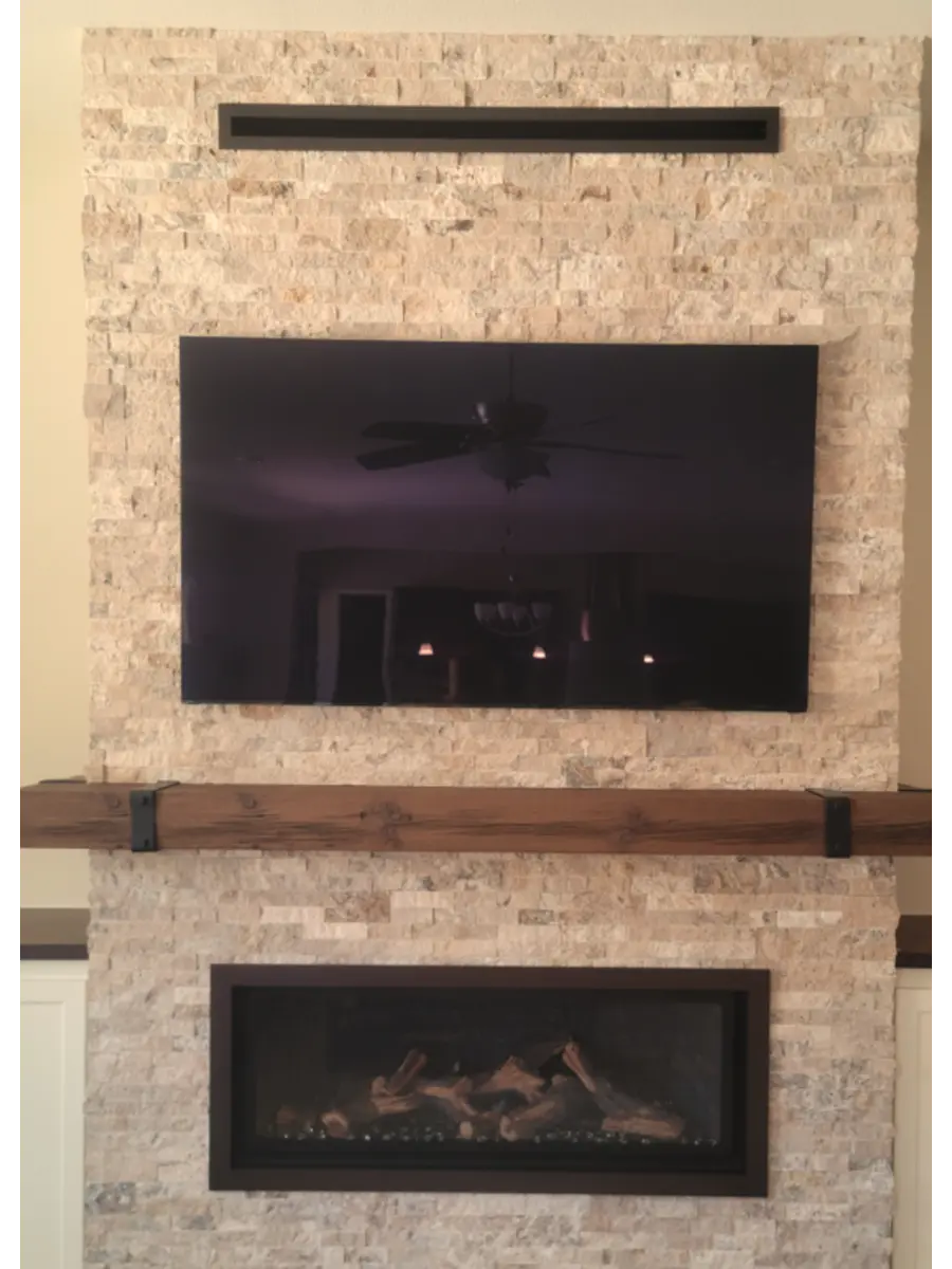 Cool wall system and box beam mantel across the top of fireplace