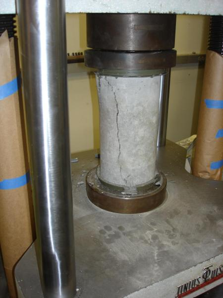 Concrete cylinder break test for compressive strength evaluation