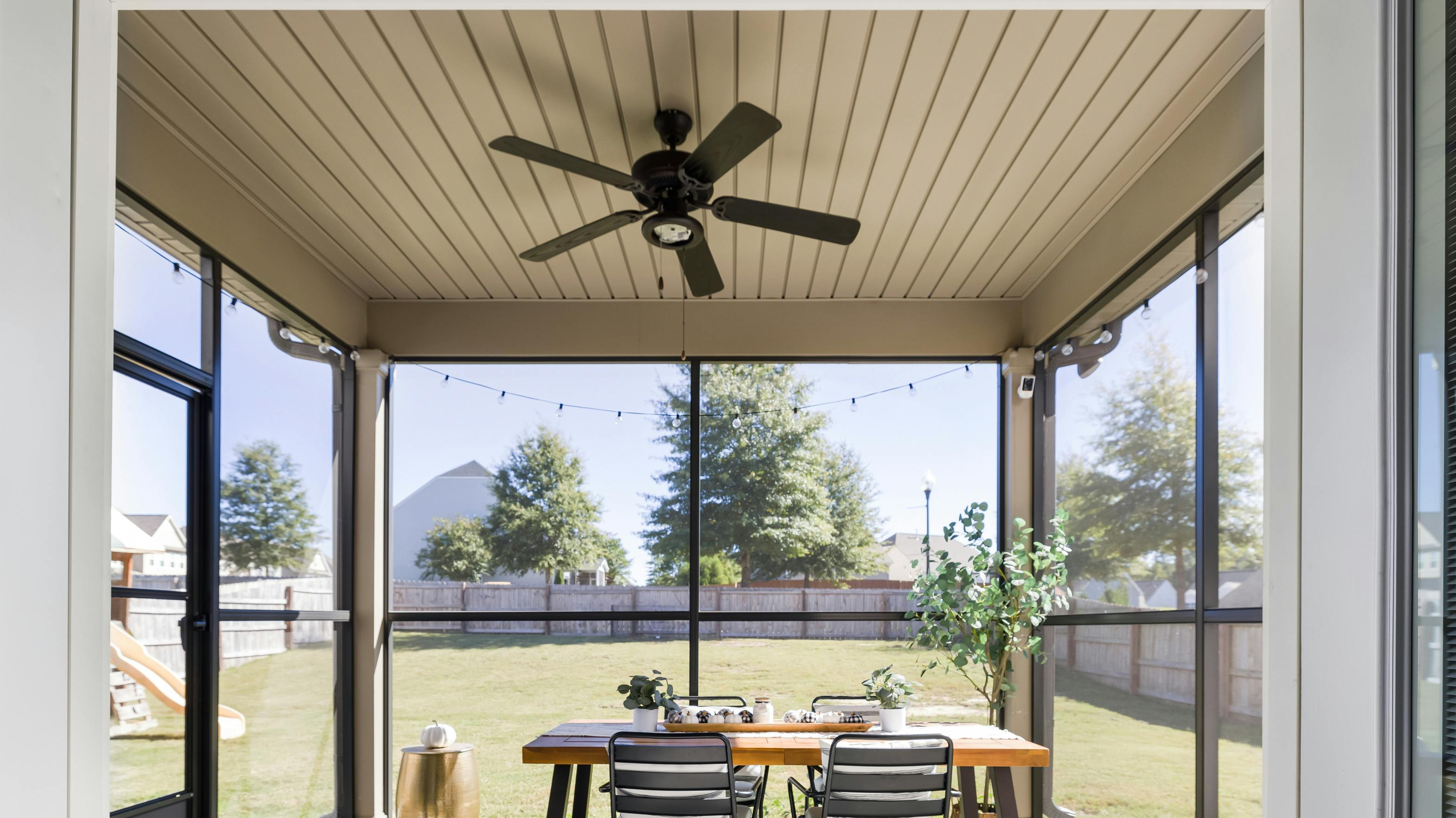 Sleek Outdoor Ceiling Fan in a Backyard Sunroom