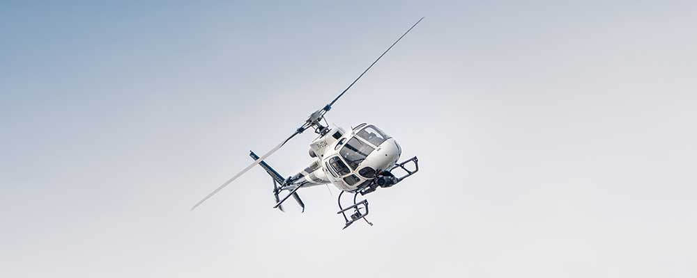 A couple taking a scenic helicopter tour of San Antonio