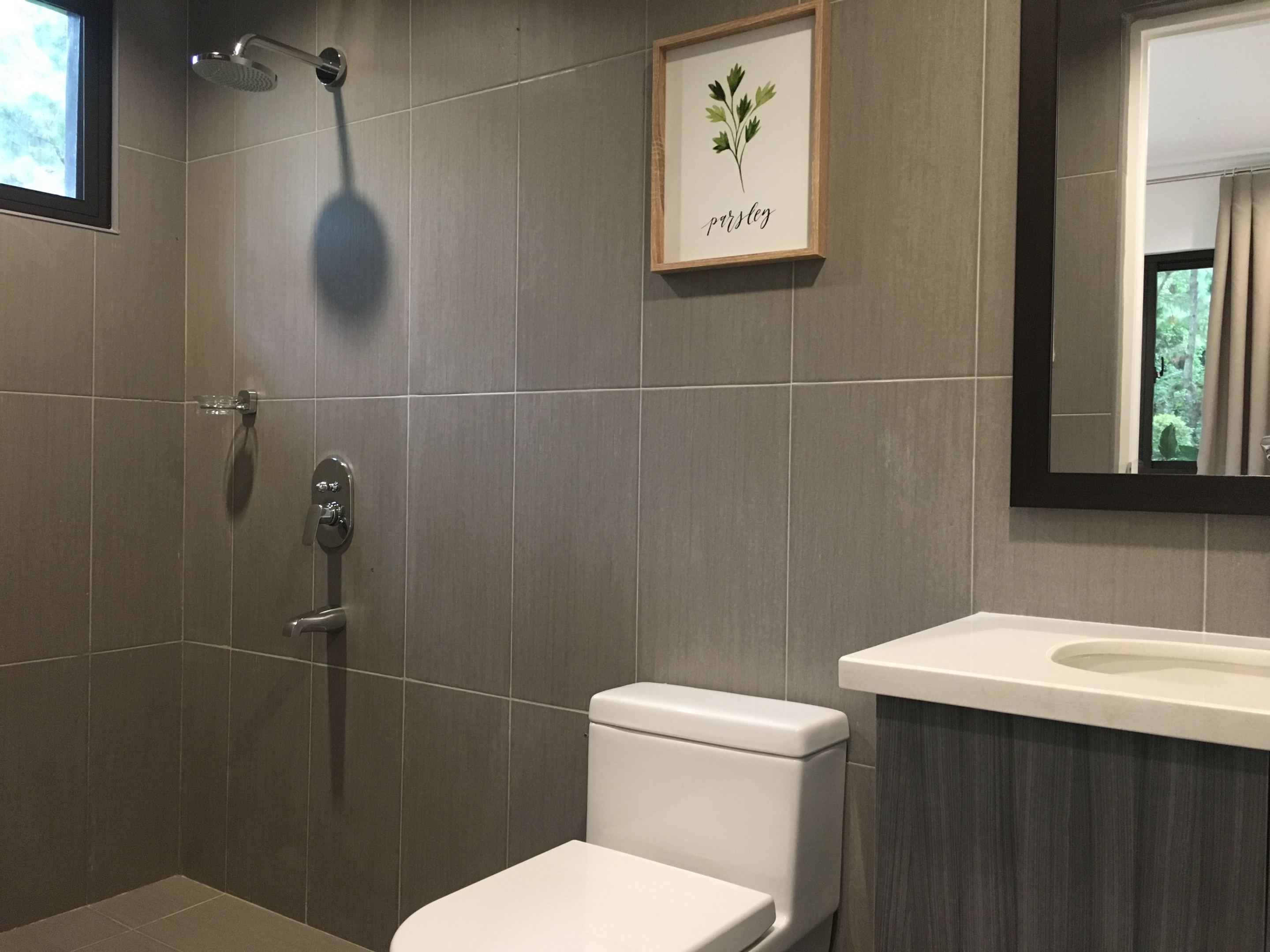 ceiling wall tiles and single tub stainless sink | Photo of Toilet and bath family room in Chatelard