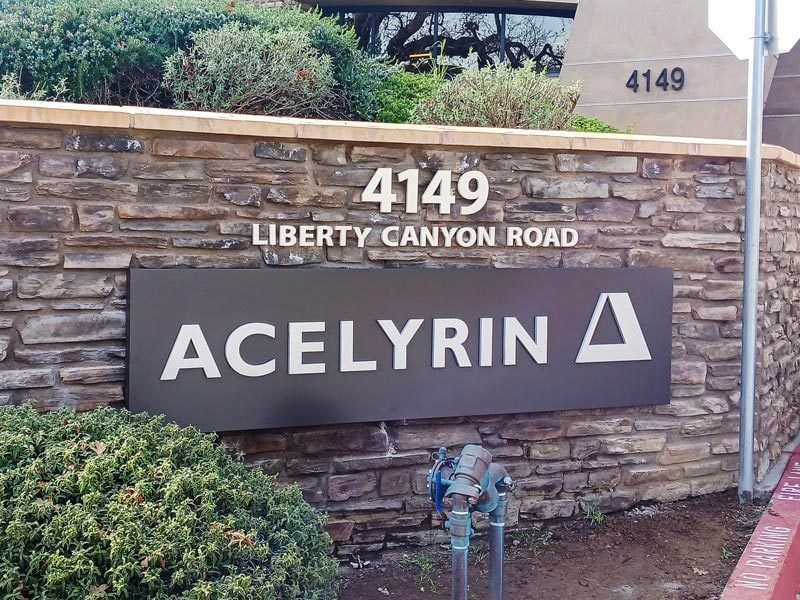 Acelyrin property management signs in Agoura Hills, CA stands out while blending in the architecture of the physical location.