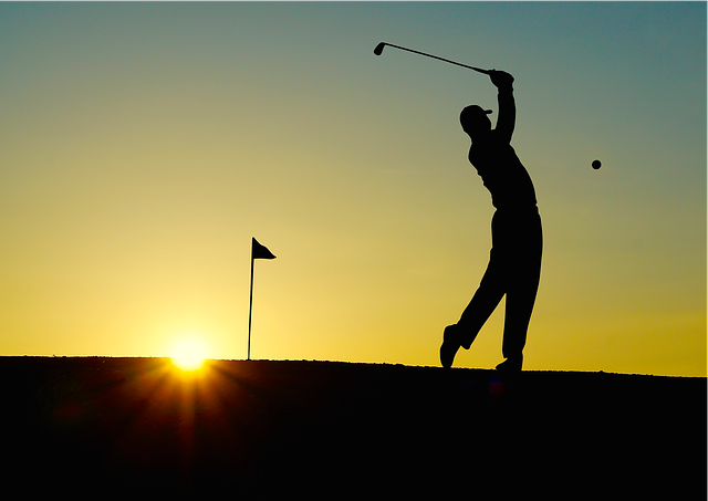 A golfer swinging a golf club