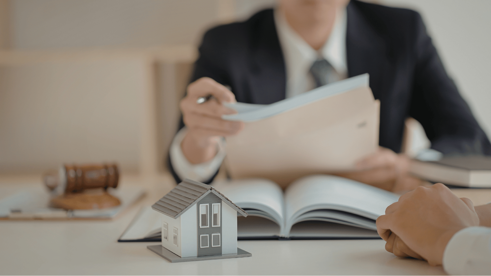 Property owner meeting with a national association professional, showing how screening tenants supports both you, your business, and fair rent increases.