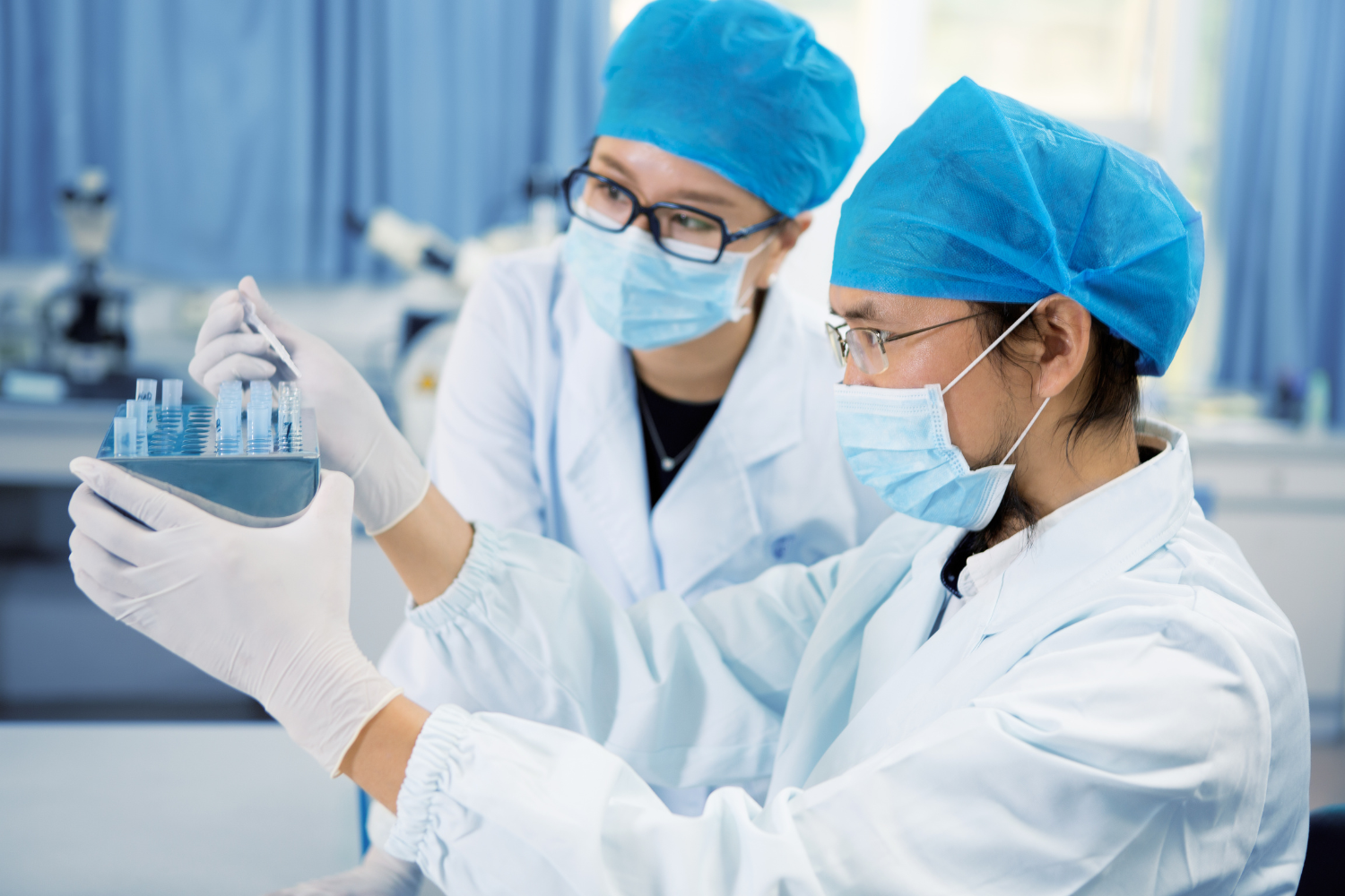 An interior view of a supplement manufacturing lab with technicians.