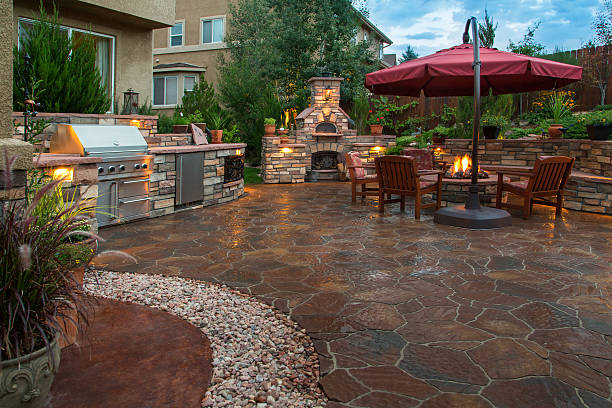 Dark stone paver patio with fire pit in outdoor space