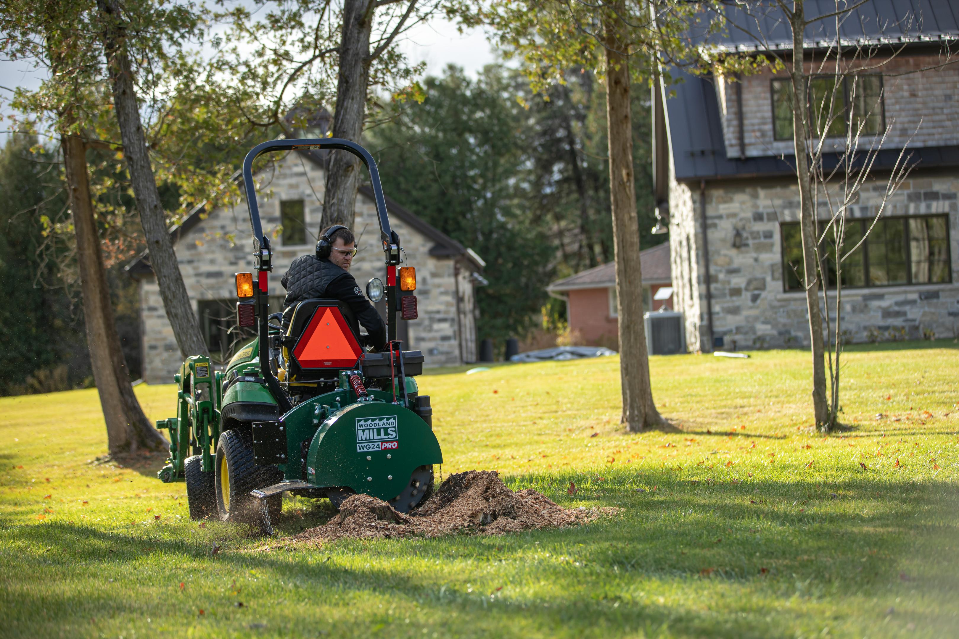 A Woodland Mills stump grinder removing a stump.