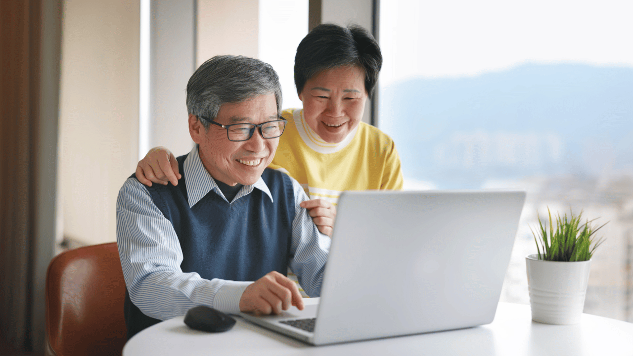 A senior couple researching and asking for referrals to find the right elder law attorney