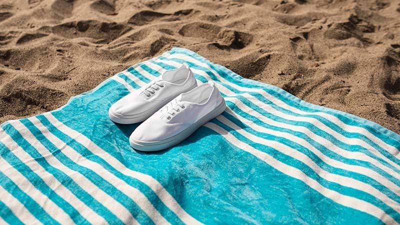 Blue and white striped beach towel