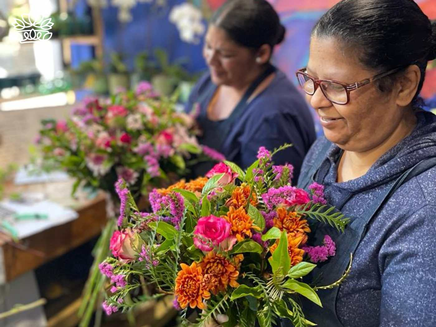 Skilled florists arranging vibrant blooms for Mother's Day, part of the Flower Bouquets Collection at Fabulous Flowers and Gifts, delivered with heart and soul.